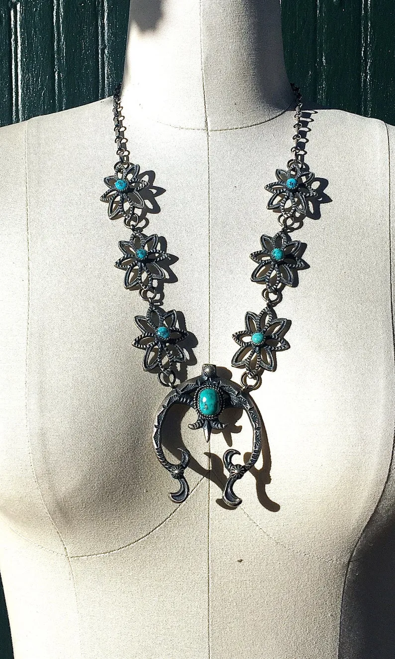 KEVIN BILLAH Sandcast Sterling Silver and Kingman Turquoise Naja Squash Blossom